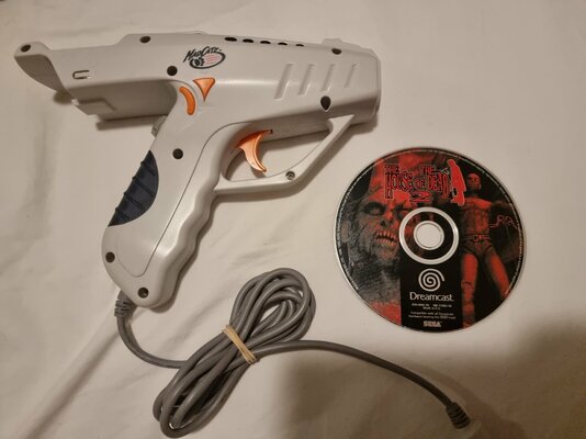 2 Sega dreamcast controllers gun and hot reg